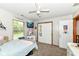 Bright bedroom with natural light, stylish decor, and a closet, offering a cozy retreat at 1031 W Morning Walk Dr, Greenfield, IN 46140