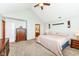 Spacious bedroom with plush carpeting and vaulted ceiling, enhanced by dark wood furniture at 1031 W Morning Walk Dr, Greenfield, IN 46140