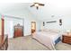Spacious bedroom with plush carpeting and vaulted ceiling, enhanced by dark wood furniture at 1031 W Morning Walk Dr, Greenfield, IN 46140