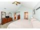 Bedroom featuring plush carpeting, a vaulted ceiling, dark wood furniture, and ensuite bath at 1031 W Morning Walk Dr, Greenfield, IN 46140