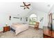 Bright bedroom featuring a large window, rocking chair, and complemented by neutral walls at 1031 W Morning Walk Dr, Greenfield, IN 46140