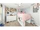 Bedroom showcases wall decor, neutral carpeting, and a lofted bed with shelving underneath at 1031 W Morning Walk Dr, Greenfield, IN 46140