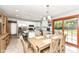 Bright kitchen with stainless steel appliances, granite countertops, and sliding glass doors to patio at 1031 W Morning Walk Dr, Greenfield, IN 46140