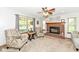 Cozy living room space showcasing a brick fireplace and traditional furnishings at 1031 W Morning Walk Dr, Greenfield, IN 46140