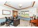 Bright and spacious office space with large window, desk, and traditional wood trim at 1031 W Morning Walk Dr, Greenfield, IN 46140
