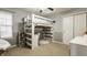 Bedroom featuring a unique loft bed design with built-in desk and shelving, maximizing space and functionality at 10380 Sand Creek Blvd, Fishers, IN 46037
