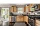 Cozy kitchen with hardwood floors, stainless steel appliances, and access to the outdoor deck at 10380 Sand Creek Blvd, Fishers, IN 46037