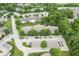 Aerial view of condo community featuring lush green trees and a parking area at 1044 Timber Creek Dr # 2, Carmel, IN 46032