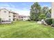 A lush green lawn surrounds the back of this well-maintained condominium property at 1044 Timber Creek Dr # 2, Carmel, IN 46032
