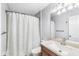 Bathroom featuring a shower with curtain, vanity with sink, mirror and modern lighting at 1044 Timber Creek Dr # 2, Carmel, IN 46032