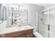 Bathroom featuring a vanity, mirror, and glass door shower with tile surround at 1044 Timber Creek Dr # 2, Carmel, IN 46032
