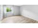 Bright bedroom featuring hardwood floors, a window with curtains, and fresh paint at 1044 Timber Creek Dr # 2, Carmel, IN 46032