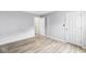Spacious bedroom featuring hardwood floors and doors to the hall and a closet at 1044 Timber Creek Dr # 2, Carmel, IN 46032