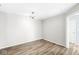 Clean, empty dining room boasting hardwood floors, modern lighting, and neutral paint at 1044 Timber Creek Dr # 2, Carmel, IN 46032