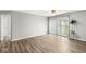 Bright living room featuring hardwood floors, sliding glass doors, and neutral paint at 1044 Timber Creek Dr # 2, Carmel, IN 46032