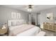 Stylishly furnished main bedroom with wooden floors and soft, neutral decor at 1044 Timber Creek Dr # 2, Carmel, IN 46032