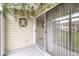 Outdoor patio with hanging vines, looking out towards lawns and other buildings at 1044 Timber Creek Dr # 2, Carmel, IN 46032