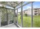 Sunroom with lattice and hanging vines, overlooking a lush backyard at 1044 Timber Creek Dr # 2, Carmel, IN 46032