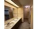 Full bathroom includes double sinks, a shower, and a walk-in closet at 10976 Mt Vernon N Trl, Indianapolis, IN 46229