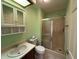 Bathroom features a sink with cabinet storage, cabinet, and a shower at 10976 Mt Vernon N Trl, Indianapolis, IN 46229