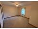 Large, neutral bedroom with carpet, a window, and a ceiling fan at 10976 Mt Vernon N Trl, Indianapolis, IN 46229