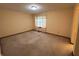 Clean and vacant bedroom features neutral walls and carpet and a window at 10976 Mt Vernon N Trl, Indianapolis, IN 46229