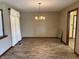 Bright dining room with tile floors, chandelier lighting, and an open layout at 10976 Mt Vernon N Trl, Indianapolis, IN 46229