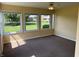 Bright sunroom featuring large windows offering ample natural light and outdoor views at 10976 Mt Vernon N Trl, Indianapolis, IN 46229