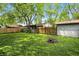 Large backyard with a lush lawn, shed, fire pit and plenty of room at 1120 W 5Th St, Greenfield, IN 46140