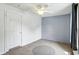 Bedroom with neutral paint, ceiling fan, and view to the backyard at 1120 W 5Th St, Greenfield, IN 46140