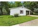 Attractive single-story house with lush green grass and a covered entry, creating a pleasant atmosphere at 1120 W 5Th St, Greenfield, IN 46140