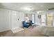 Cozy living room with plush carpeting, neutral walls, and comfortable seating, creating a relaxing space at 1120 W 5Th St, Greenfield, IN 46140