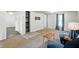 Carpeted living space with comfortable seating, an open shelving unit, and neutral tones, creating a relaxing atmosphere at 1120 W 5Th St, Greenfield, IN 46140