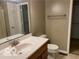 Bathroom featuring a single sink vanity, neutral walls, and a shower/tub combo at 1128 Brookside Ct, Avon, IN 46123