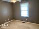 This room is a basic, functional bedroom with carpet and a window at 1128 Brookside Ct, Avon, IN 46123
