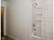 Bathroom featuring a shower-tub combo with white tile and a shower curtain at 11522 Newport Dr, Indianapolis, IN 46236