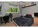 Bedroom with a window overlooking a leafy backyard and a comfy bed at 11522 Newport Dr, Indianapolis, IN 46236