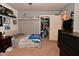 Bedroom with closet storage, neutral carpet, and fan at 11522 Newport Dr, Indianapolis, IN 46236