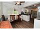 Cozy dining room and kitchen area with hardwood floors, offering a comfortable space to relax or eat at 11522 Newport Dr, Indianapolis, IN 46236