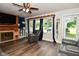 Cozy living room with hardwood floors, offering a fireplace and large windows for natural light at 11522 Newport Dr, Indianapolis, IN 46236