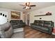 Inviting living room with hardwood floors and comfortable sofas, creating a welcoming atmosphere for guests at 11522 Newport Dr, Indianapolis, IN 46236