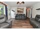 Comfortable living room with hardwood floors and a large couch, perfect for relaxing and entertaining guests at 11522 Newport Dr, Indianapolis, IN 46236