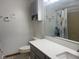 Bright bathroom features gray cabinets, white countertops, and updated fixtures at 1165 Tewksbury Ct, Mooresville, IN 46158