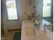 Dual vanity bathroom offers quartz counters and plenty of natural light from window at 1165 Tewksbury Ct, Mooresville, IN 46158