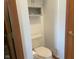 Modern bathroom with toilet, toilet paper holder, and storage above the toilet at 1165 Tewksbury Ct, Mooresville, IN 46158
