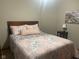 Comfortable bedroom with pink floral bedding and hardwood floors at 1165 Tewksbury Ct, Mooresville, IN 46158