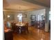 Traditional dining room featuring hardwood floors, a wooden table with chairs, and a decorative light fixture at 1165 Tewksbury Ct, Mooresville, IN 46158