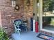 Cozy front porch with decorative chair and seasonal decorations that offer a welcoming entrance to the home at 1165 Tewksbury Ct, Mooresville, IN 46158