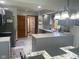 Spacious kitchen features stainless steel appliances, gray cabinetry and granite countertops at 1165 Tewksbury Ct, Mooresville, IN 46158