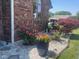 Beautiful landscaping featuring colorful rose bushes and ornamental trees that add a touch of nature to the home's exterior at 1165 Tewksbury Ct, Mooresville, IN 46158